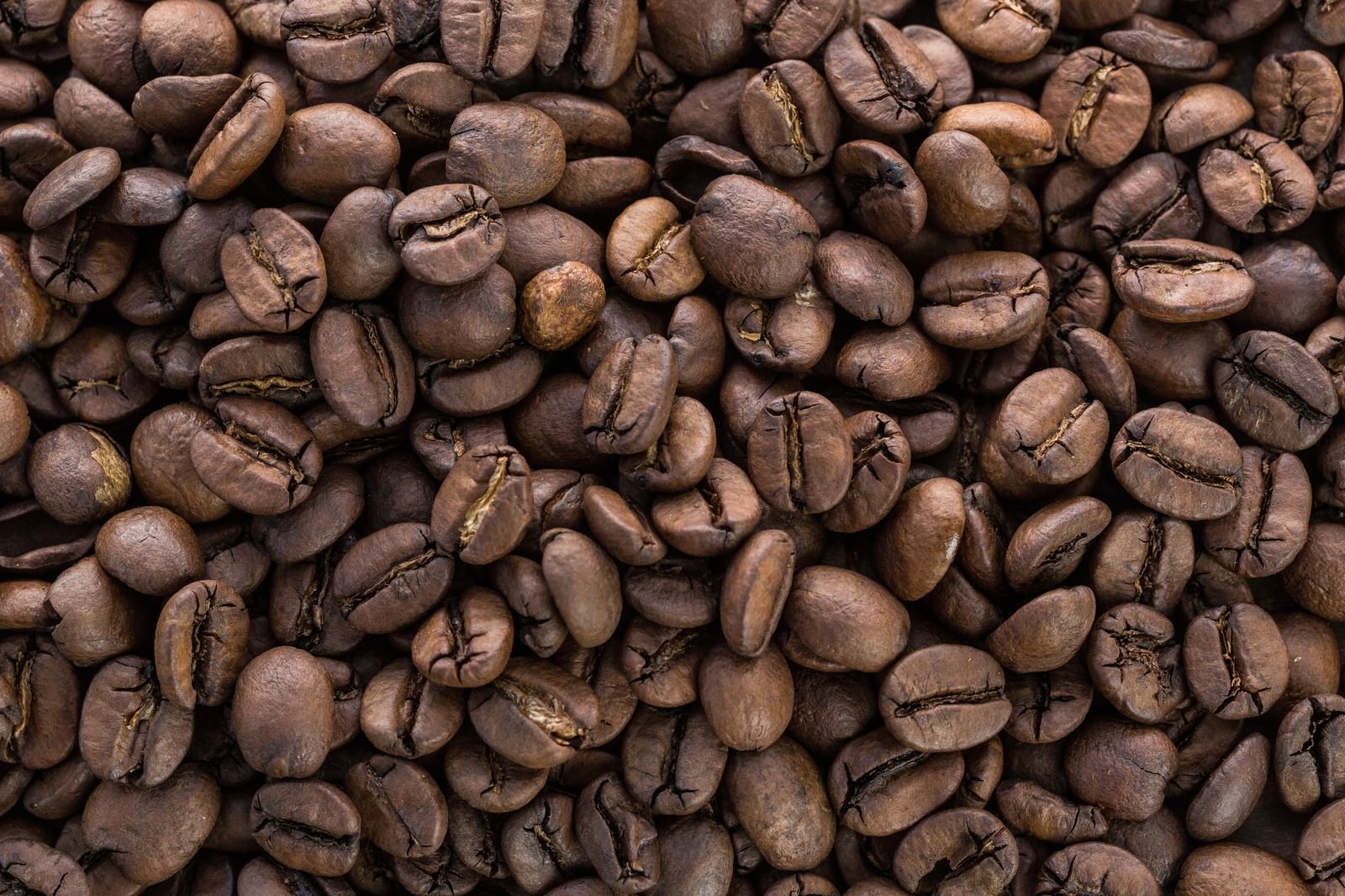 敷き詰められたコーヒー豆の写真 画像 フリー素材 ぱくたそ