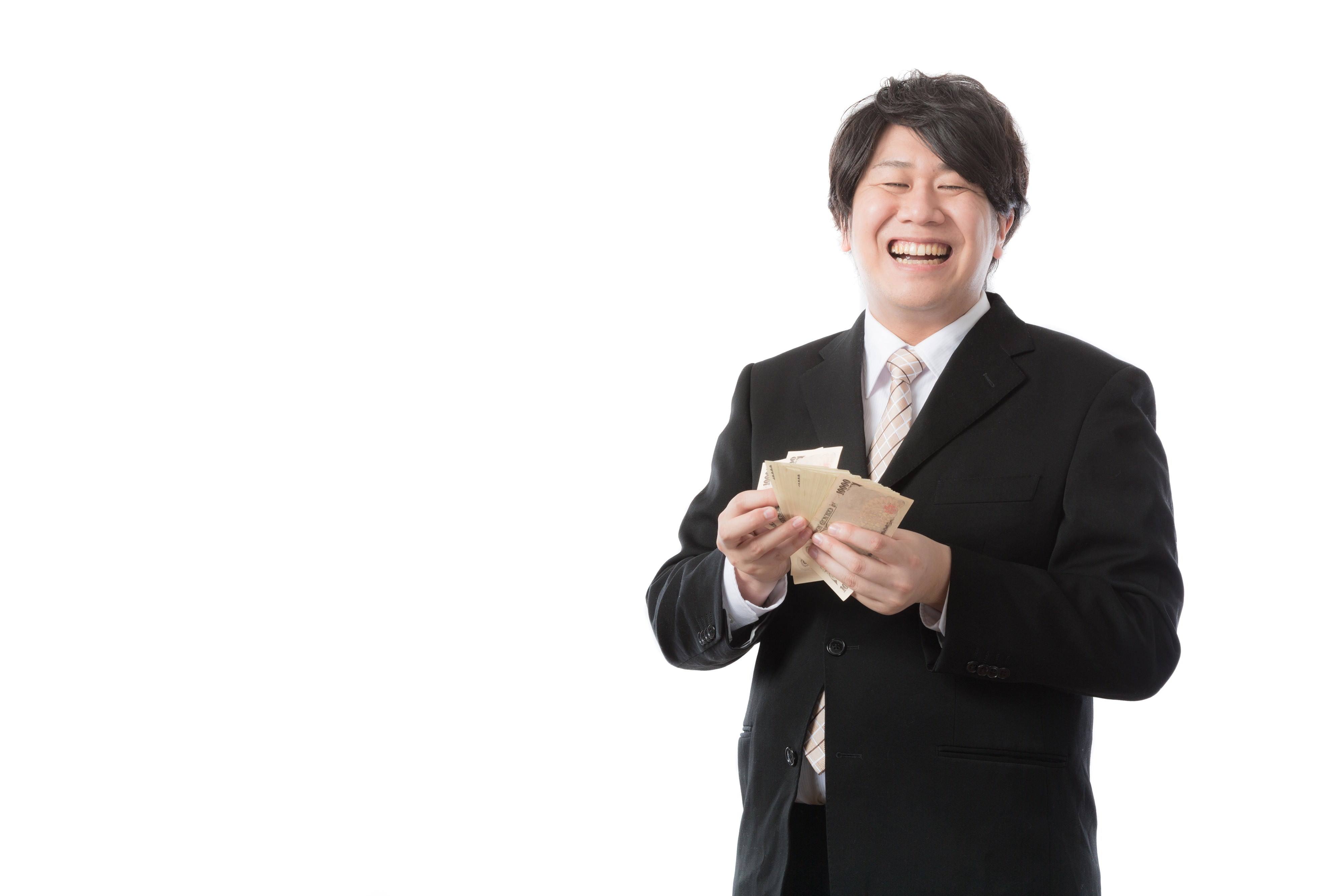 秒速で札束をカウントする銀行職員｜ぱくたそフリー素材