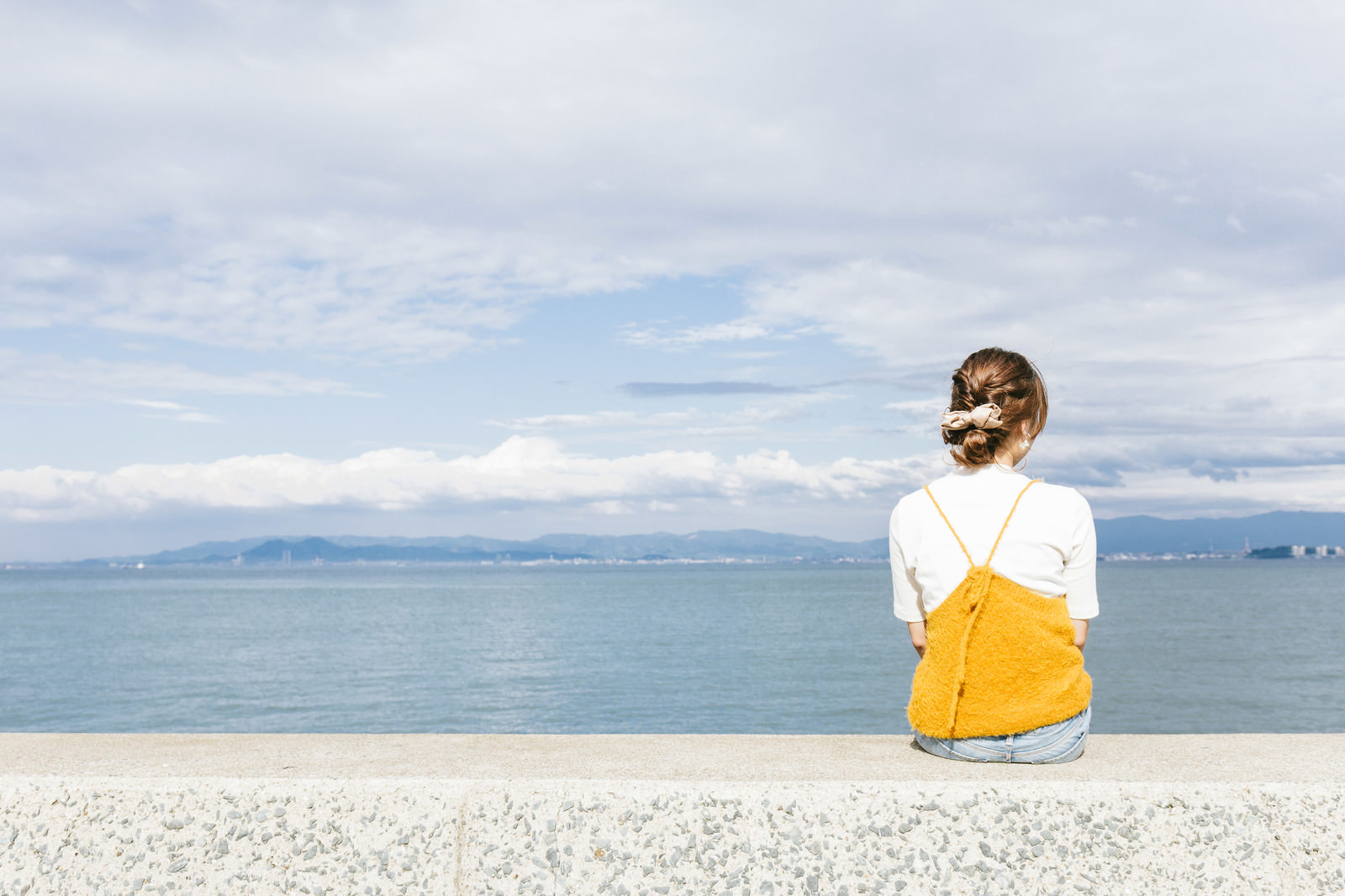 ãå é ­ã«åº§ãå¥³å­ãã®åç