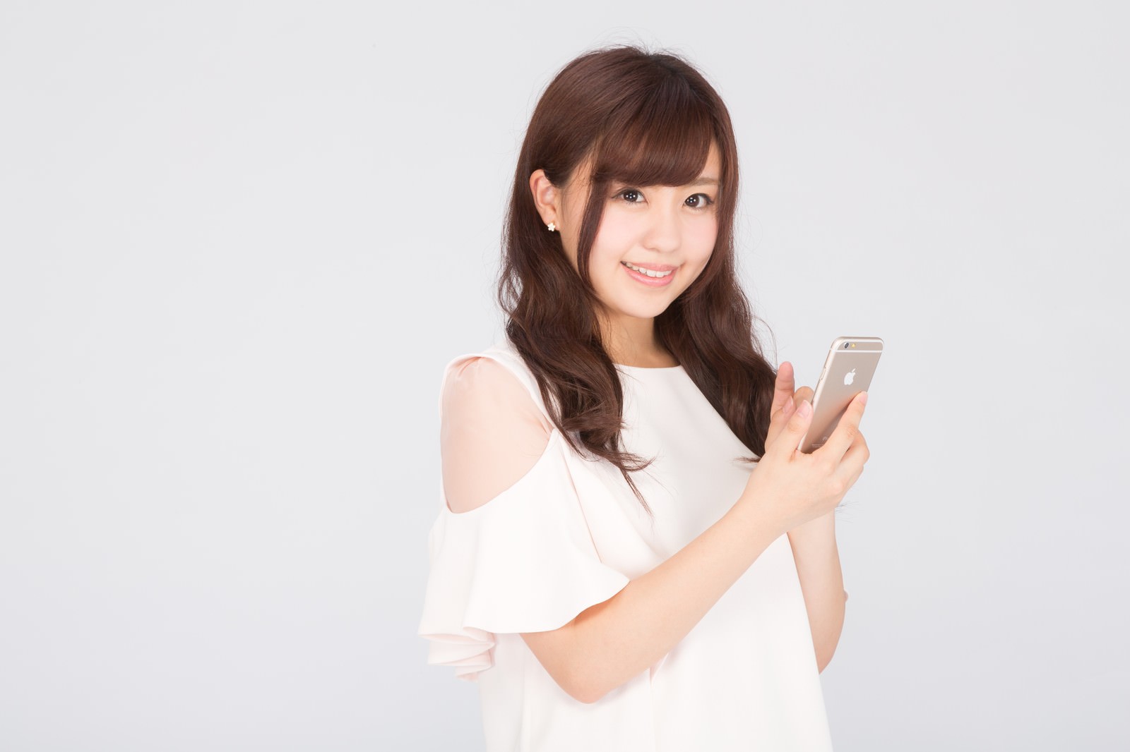 「続きはスマートフォンアプリでチェックしてね！続きはスマートフォンアプリでチェックしてね！」［モデル：河村友歌］のフリー写真素材を拡大