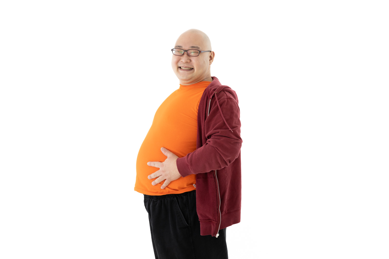 「たくさん食べたらお腹が膨れちゃった | フリー素材のぱくたそ」の写真［モデル：あまやん］
