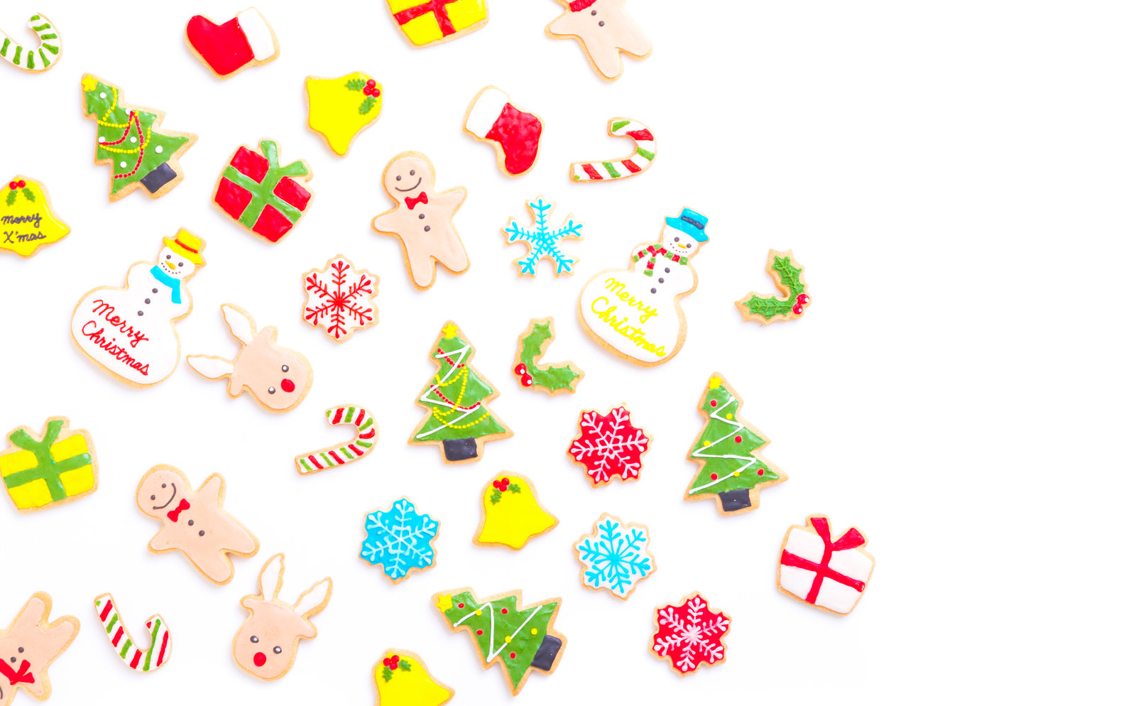 「散らばったクリスマス・アイシングクッキー | フリー素材のぱくたそ」の写真