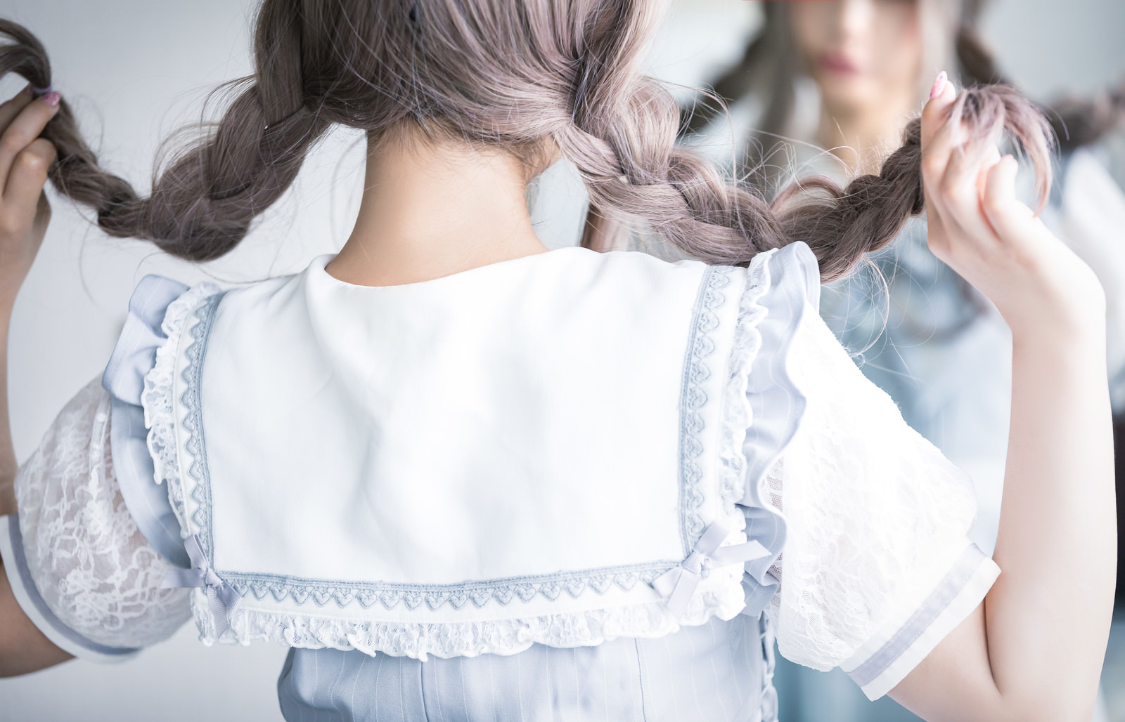 「三編みハッピー」の写真［モデル：石投げて美奈代］
