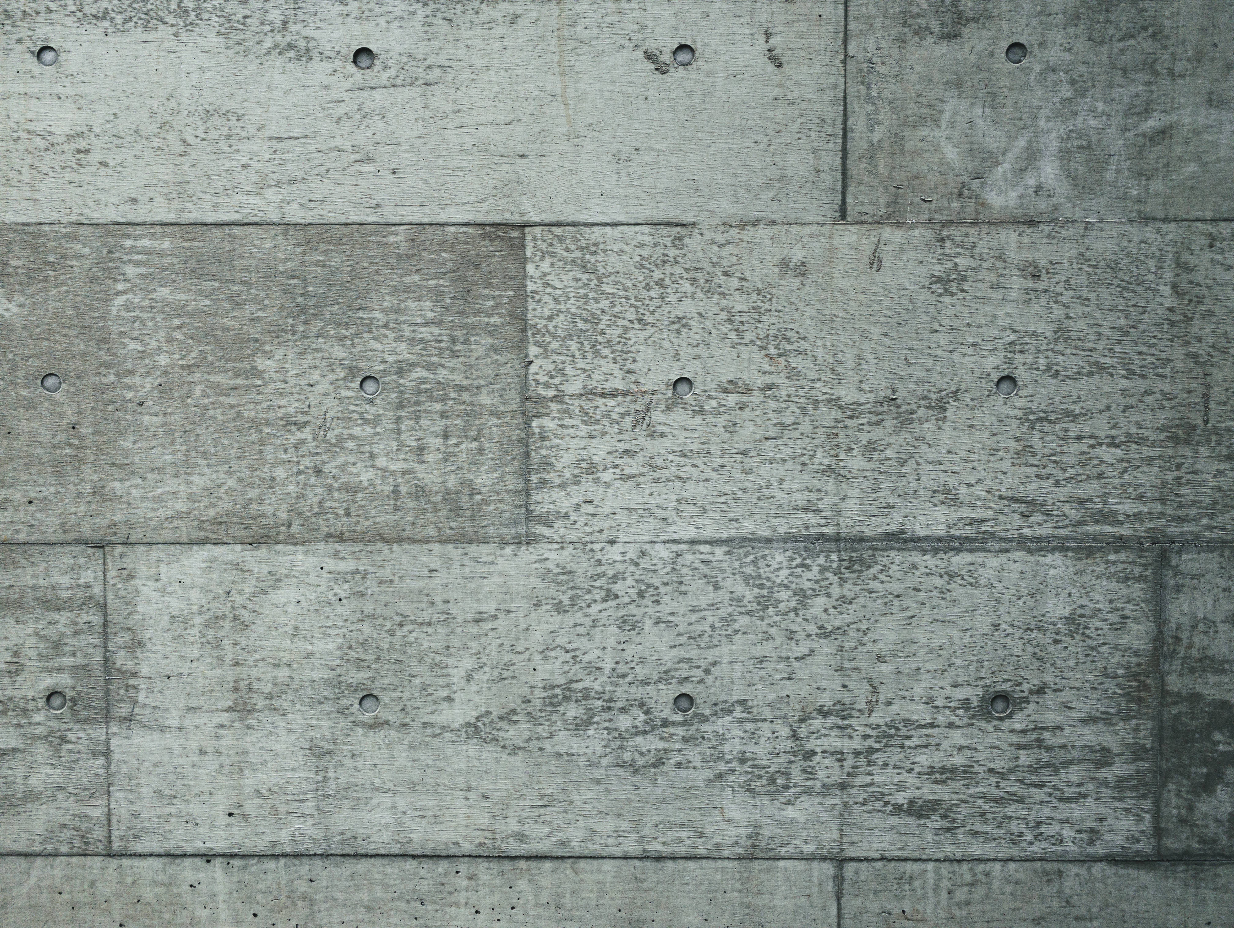 コンクリート打ちっぱなしの壁に残るピーコン跡 テクスチャ の写真を無料ダウンロード フリー素材 ぱくたそ