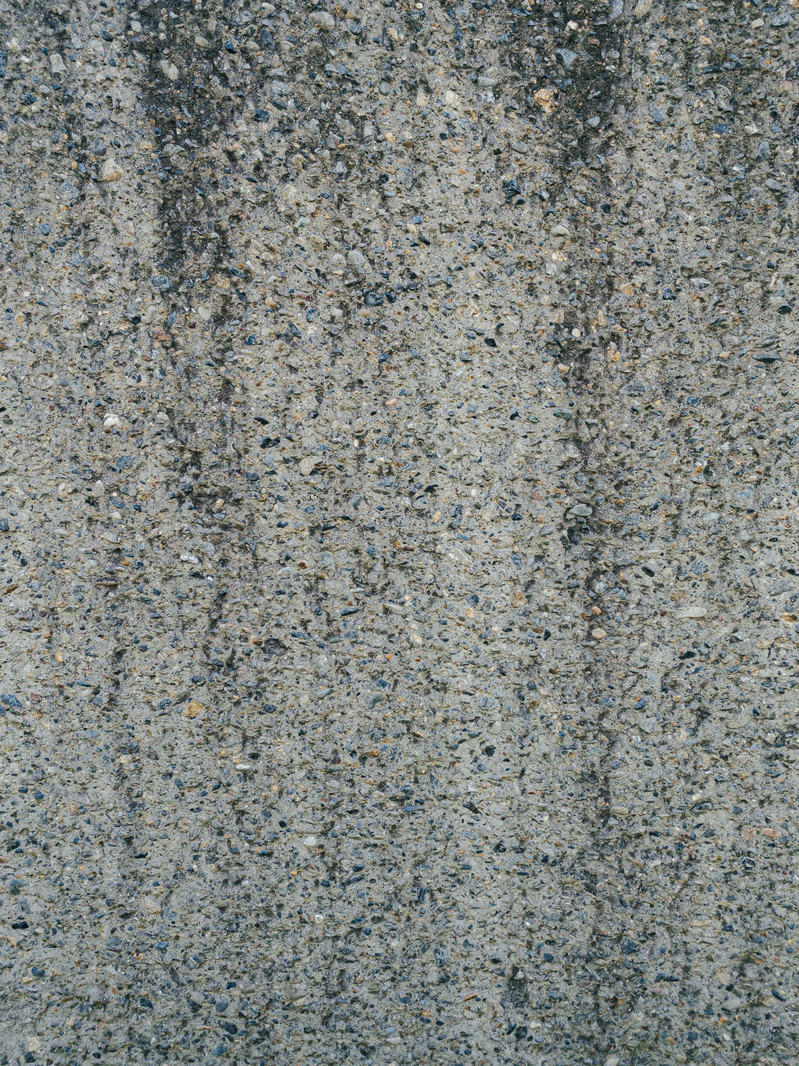 「砂利の混ざったセメント壁（テクスチャ）」の写真