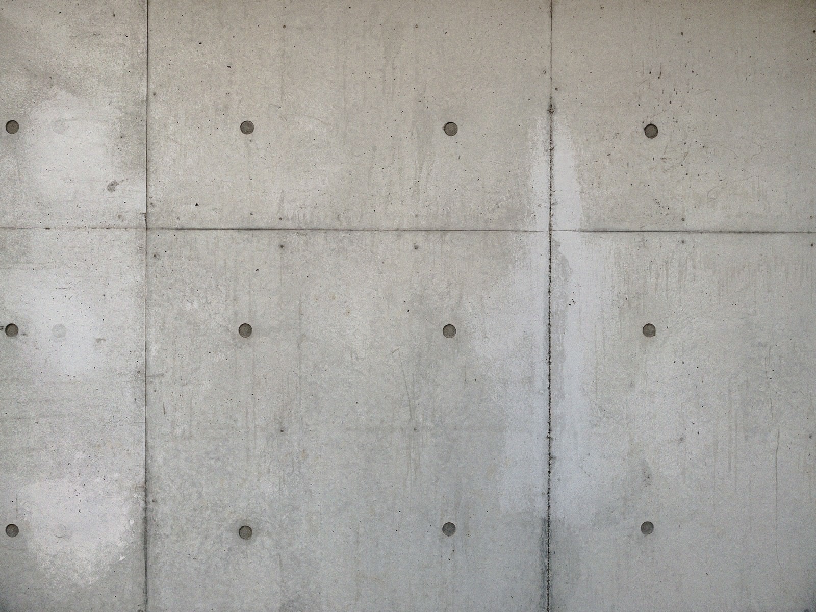 「コンクリート打ちっぱなしの外壁 | フリー素材のぱくたそ」の写真