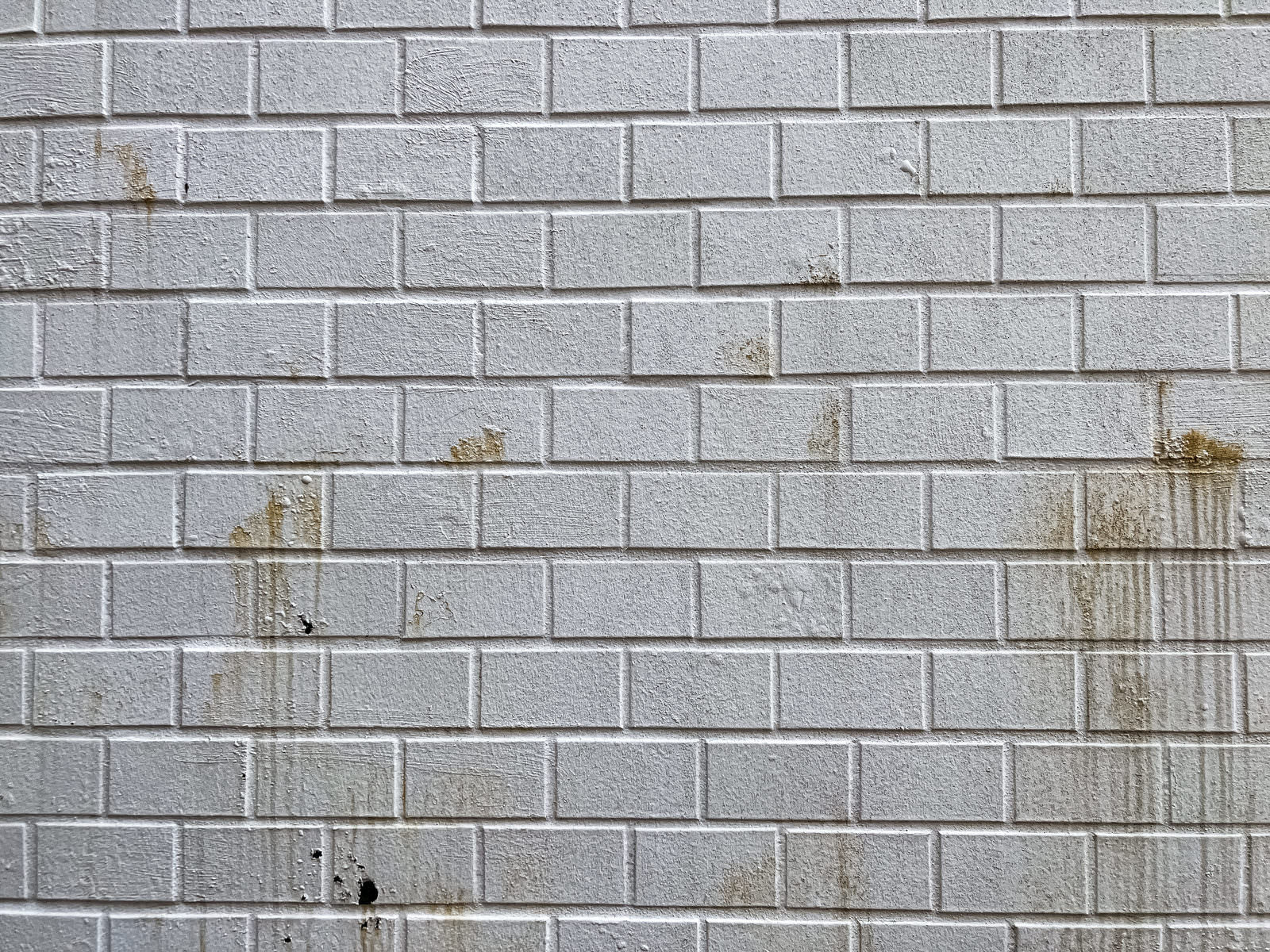 「茶色い汚れの付いた壁のテクスチャー | フリー素材のぱくたそ」の写真