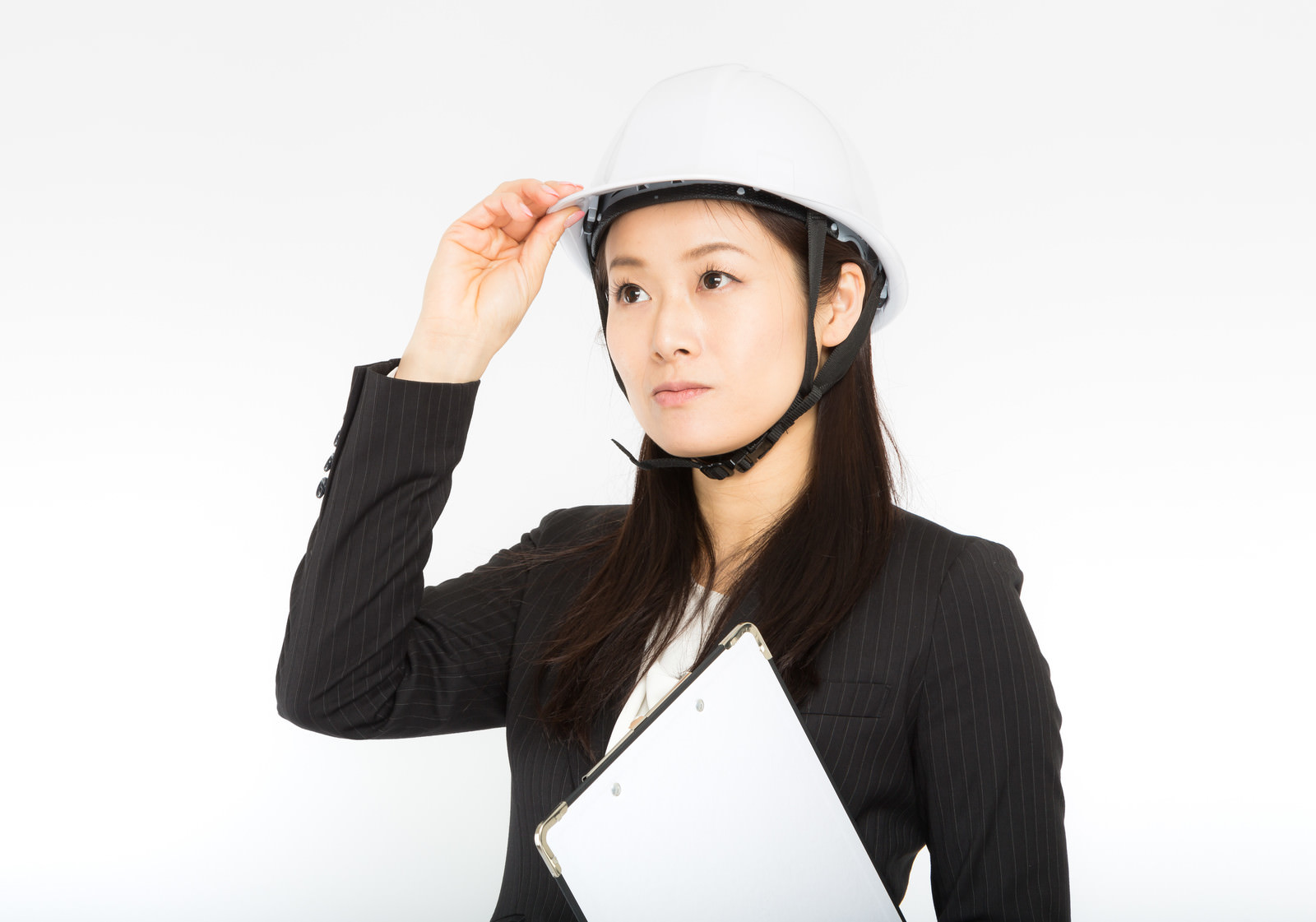 「災害時はヘルメットを着用する女性社員」の写真［モデル：土本寛子］